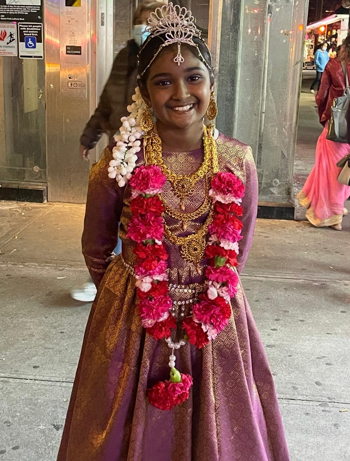 Mother Lakshmi 4 Lilly in purple and gold cultural dress.